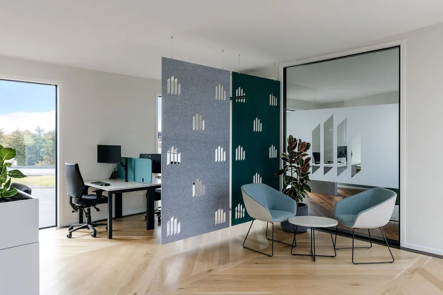 A boardroom at Lumberbank with a timber table and exposed brick